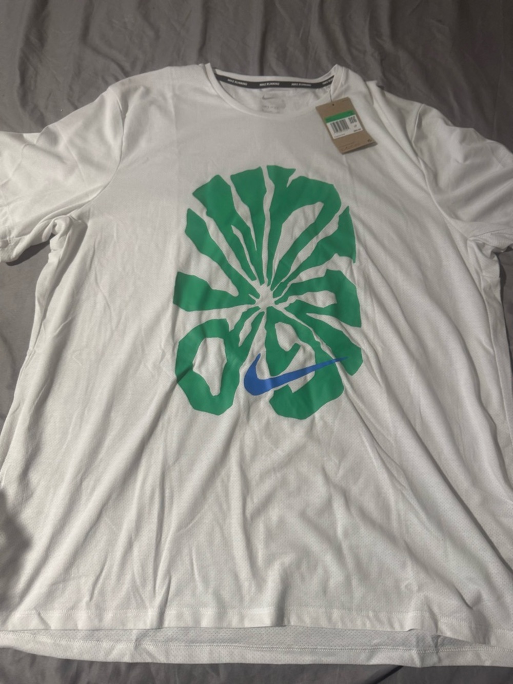 Nike White T-Shirt with Green Graphic and Blue Swoosh